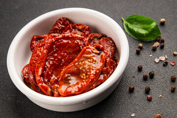 Sun-dried tomatoes snack vegetables natural product tasty snack fresh delicious gourmet food background on the table rustic top view copy space keto and paleo diet vegan and vegan food