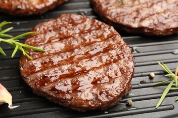 Pan with grilled patties and spices, closeup