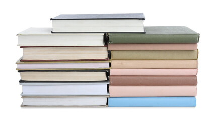 Group of different stacked books isolated on white