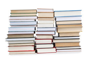 Stacks of many books isolated on white
