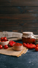 Fresh tomatoes and tomato sauce in a rustic setting