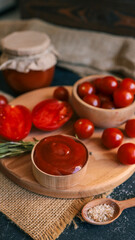 Fresh tomato sauce with ingredients on a wooden board