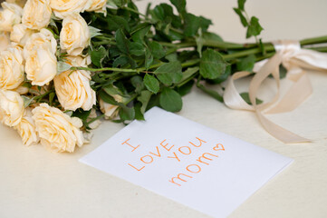 Children’s handmade greeting card for Mother's Day with a fresh yellow rose bouquet,