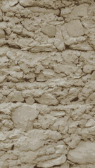 Old adobe construction showing erosion and cracks