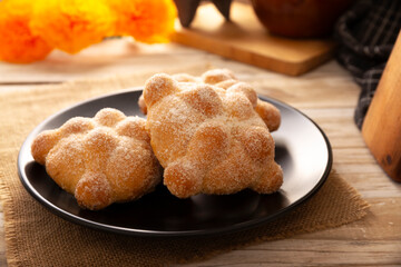 Pan de Muerto. Typical Mexican sweet bread that is consumed in the season of the day of the dead. It is a main element in the altars and offerings in the festivity of the day of the dead.