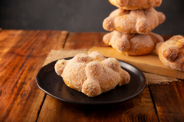 Pan de Muerto. Typical Mexican sweet bread that is consumed in the season of the day of the dead. It is a main element in the altars and offerings in the festivity of the day of the dead.