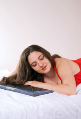 Fototapeta premium Young Woman Online Shopping from Bed