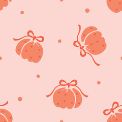 Cute pumpkins with bows seamless pattern on soft peach, playful polka dots in coral tones, hand-drawn fall repeat for fabric, wrapping paper, kids apparel and cozy seasonal decor