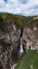 Flying over the Jily-Su Waterfall in the Caucasus in the summer