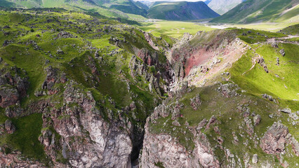 Flying over the Jily-Su Waterfall in the Caucasus in the summer