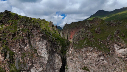 Flying over the Jily-Su Waterfall in the Caucasus in the summer