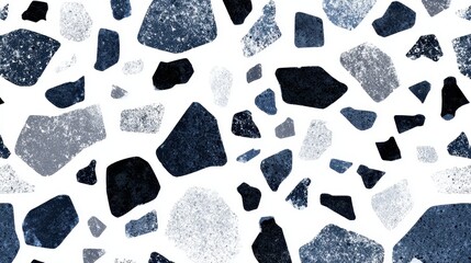 Terrazzo pattern creating a seamless abstract background with various sized, rough textured fragments in deep blue, light gray, and black scattered across a clean white surface