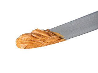 Peanut butter portion on stainless steel knife
