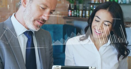 Leaning toward tablet colleagues studying sales data driving floating charts illustrating insights