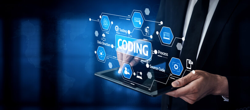 A businessman interacts with a digital tablet displaying coding graphics and technology icons, showcasing the blend of innovation and professionalism in modern work environments. Tessel - Powered by Adobe