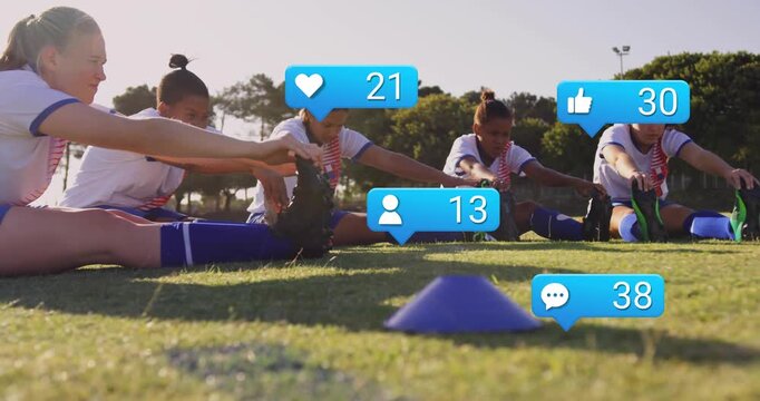 Soccer squad stretching hamstrings on grassy field social icons appearing by cone counts rising