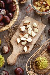 Chopped fresh horse chestnut seeds harvested in autumn - preparation of homemade herbal tincture
