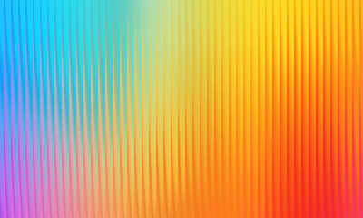 Abstract background featuring a ribbed texture and a bright gradient transitioning from blue to orange and red background