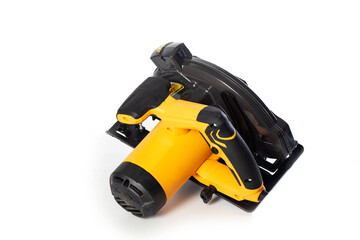A powerful electric hand-held circular saw isolated on a white background, close-up. Woodworking tool.