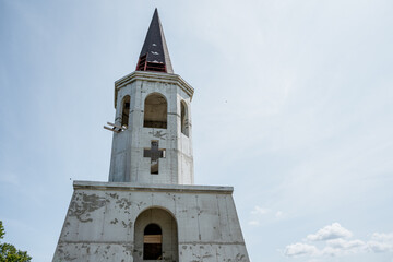 Church with a cross and a pointed roof