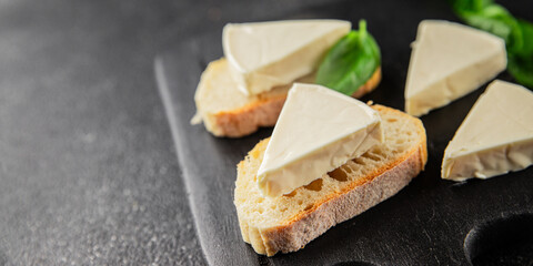 Processed cheese triangle spread portion size cheese for sandwich tasty snack fresh delicious gourmet food background on the table rustic food top view copy space