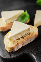 Processed cheese triangle spread portion size cheese for sandwich tasty snack fresh delicious gourmet food background on the table rustic food top view copy space