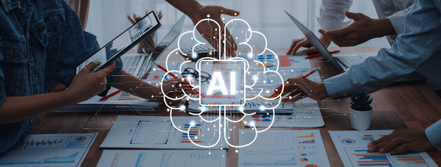 Naklejka premium Business professionals engage in collaborative efforts, utilizing technology and AI concepts while analyzing charts and strategies in a modern workspace. Trope