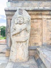 The majestic Dvarapala (guardian deity) sculptures stand sentinel at the entrance of Gangaikonda Cholapuram temple in Tamil Nadu, carved in stone by Chola artisans to protect the sacred shrine