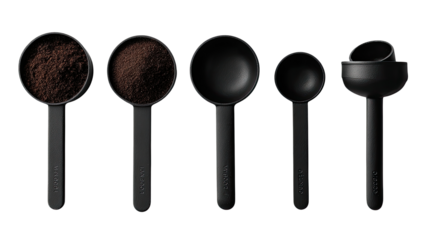 Five black measuring cups, varying sizes, filled with dark brown powder