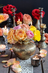 Romantic table decoration with roses and candles. Valentine's Day decorating ideas.