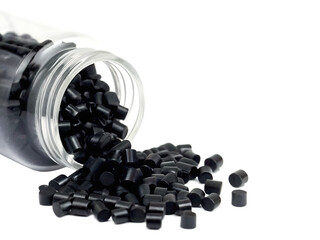 Plastic pellets spilling from clear container isolated on a transparent background