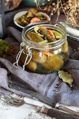 Pickled cucumbers in glass jar.