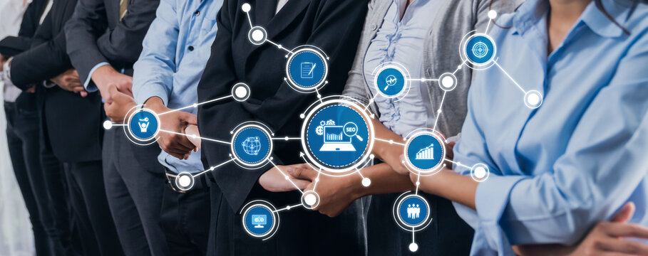 Diverse business professionals stand together, symbolizing teamwork and collaboration, enhanced by digital icons representing modern communication strategies in corporate settings. Amity