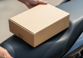 Hands Placing Delivery Box on Motorcycle Seat