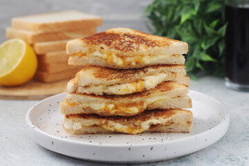 Grilled cheese sandwiches served for eating