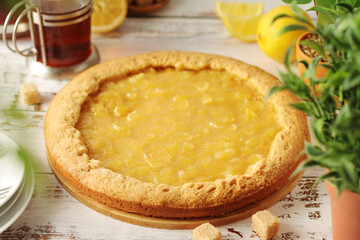 A tart with lemon marmalade served on the table	