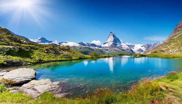 the blue lake and the matterhorn in a scenic summer landscape with sunny lights seen from breuil cervinia aosta valley italy