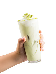 Hand holding a tall glass of light green, iced matcha drink topped with whipped cream