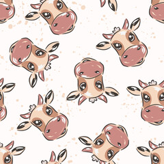 Cute cow heads pattern on white background with splatters, animal kids print.