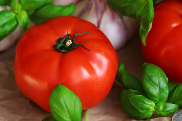 large tomatoes with basil and garlic