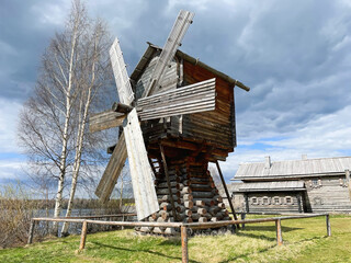 Ancient Wooden Mill near Birch Trees under Cloudy Sky