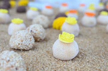 white brazilian brigadeiro party candy, sweet gourmet bonbon for celebrations, traditional handmade dessert close up, confectionery texture and details

