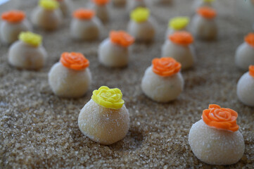 white brazilian brigadeiro party candy, sweet gourmet bonbon for celebrations, traditional handmade dessert close up, confectionery texture and details

