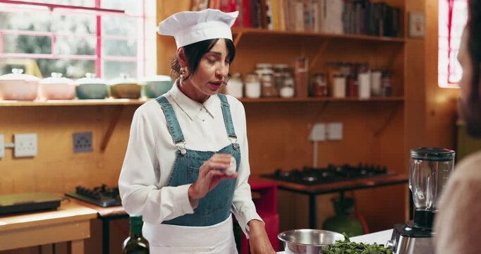 Cooking class, talking and chef with ingredients in kitchen for meal prep, instructions and advice. Culinary education, professional and people in masterclass with cuisine guidance and explain steps