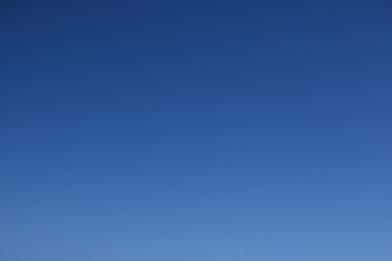 clear blue sky background with subtle color gradient, vibrant and pristine summer atmosphere for copy space, blank natural backdrop without clouds or objects, clean empty overhead view on a sunny day
