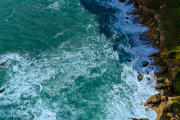 Fototapeta premium Aerial seascape with turquoise water and rocks
