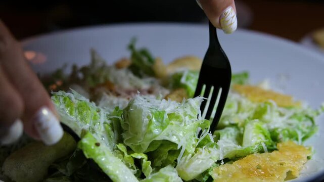 Caesar salad. Classic Caesar salad with romaine lettuce, croutons, baked chicken fillet, Parmesan cheese and dressed with sauce. High quality 4k footage