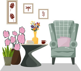 A large, cozy armchair in the living room. A comfortable nook for relaxing at home. Interior with furniture. A modern, futuristic table with a vase and bouquet, books, and a cup. Simple paintings on