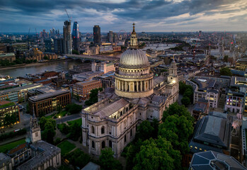 Fototapeta premium Aerial evening view of the illuminated St. Pauls Cathedral with Blackfriars and Westminster in the background, London skyline, England
