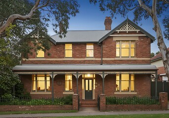 Australian federation style brick house. The home features verandahs and bay window